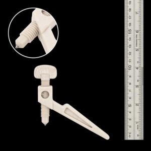 Spartan Wedge Clamp in Radel, pictured next to a metal ruler